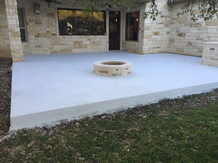 PetraBroom patio after its second coat surrounding a circular stone fire pit