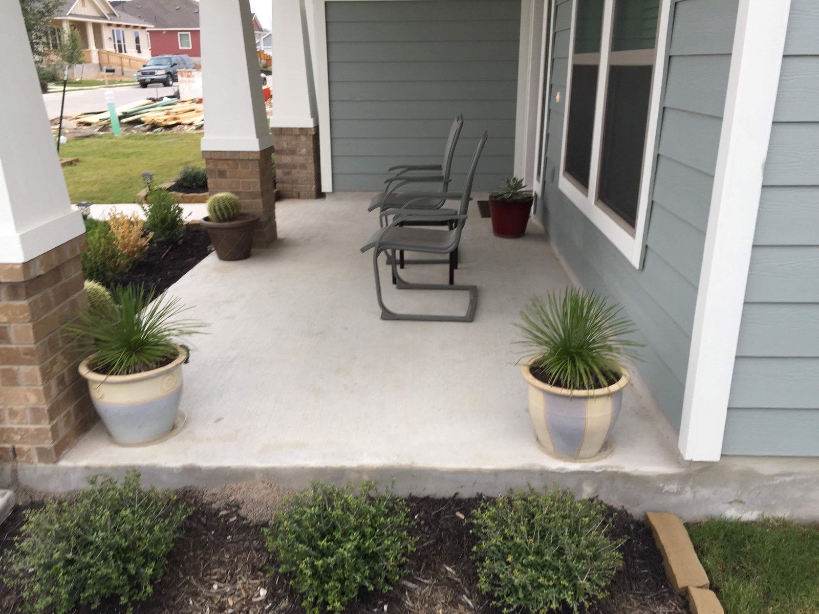 Existing light gray concrete porch before application of the PetraStamp system
